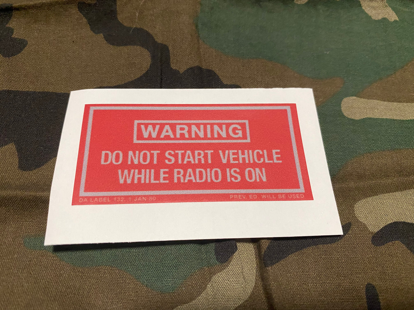 DO NOT START WHILE RADIO IS ON WARNING DECAL (1980 VERSION)