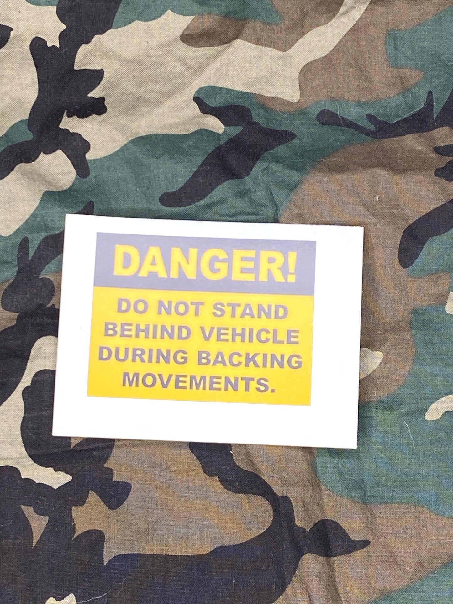 DANGER DO NOT STAND BEHIND VEHICLE DURING BACKING MOVEMENTS